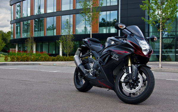 Real 2011 Suzuki GSX-R750 outdoors, illustrating an older owner build and not the 2027 anniversary model