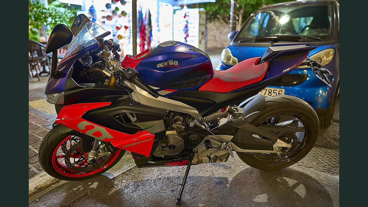 Real 2022 Aprilia RS 660 parked on an Athens street, photographed by George E. Koronaios, CC BY-SA 4.0; dark side margins added for wide crop; not a NiceFairings kit installation