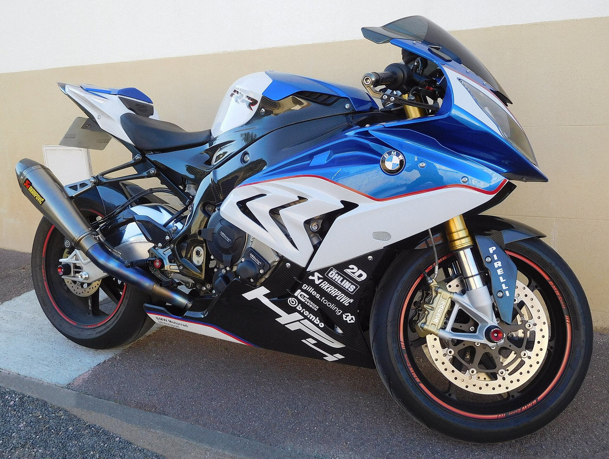 Blue and white BMW HP4-marked bodywork with a thin red separator, photographed outdoors