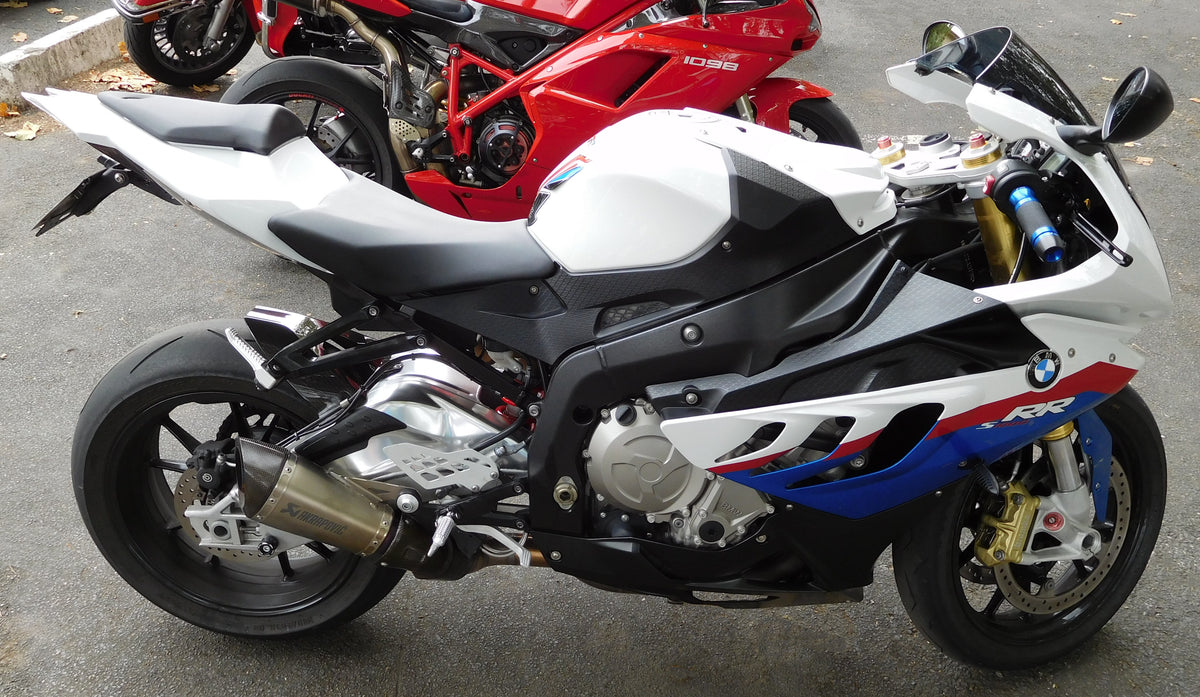 Unaltered real BMW S1000RR photographed in 2016 from vehicle right, showing the asymmetric side gills and complete fairing profile; orientation reference only