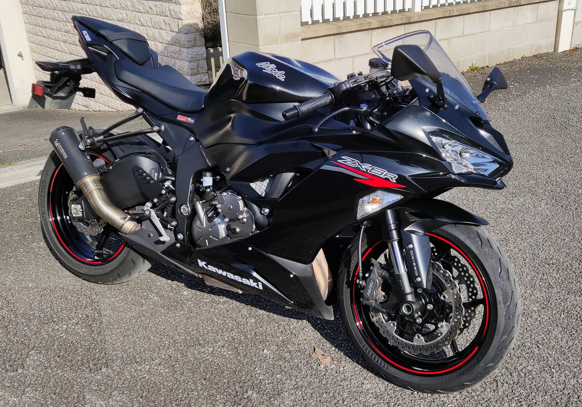 Real black Kawasaki Ninja ZX-6R parked outdoors; editorial photo, not the hypothetical scuffed listing or a NiceFairings product