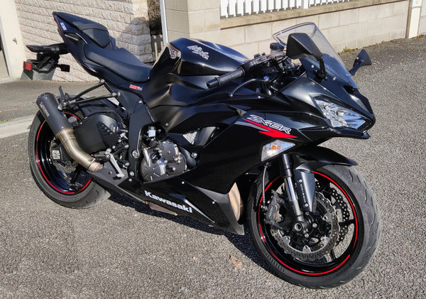 Real black Kawasaki Ninja ZX-6R parked outdoors; editorial photo, not the hypothetical scuffed listing or a NiceFairings product