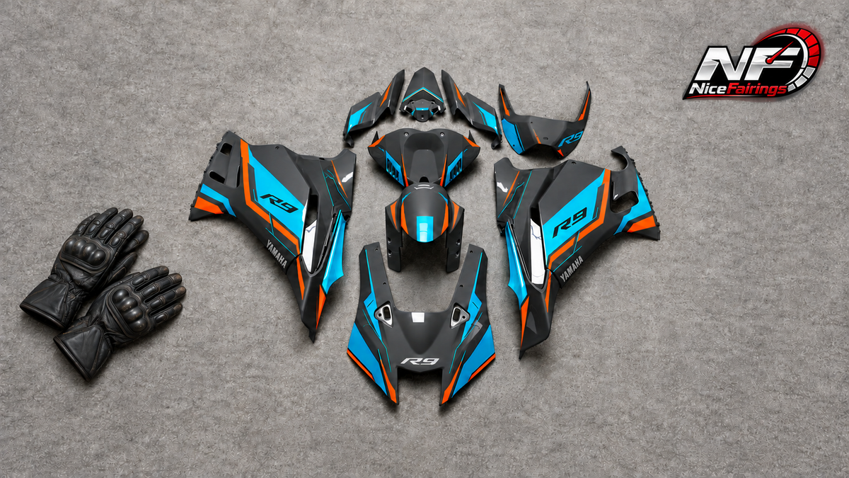 Owner-supplied black, cyan and orange YZF-R9 fairing-panel flat lay with AI-added unbranded riding gloves and small NiceFairings logo; editorial visual, not slider-fitment evidence