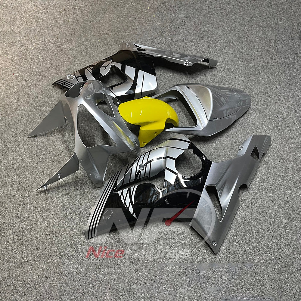 Kawasaki ZX6R 2003-2004 Silver-gray graphic panels with yellow center - angled view