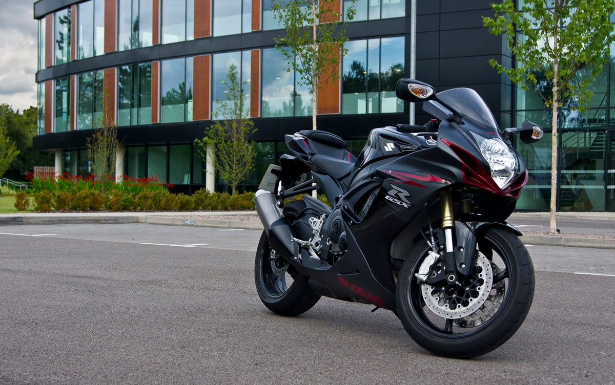 Real 2011 Suzuki GSX-R750 outdoors, illustrating an older owner build and not the 2027 anniversary model