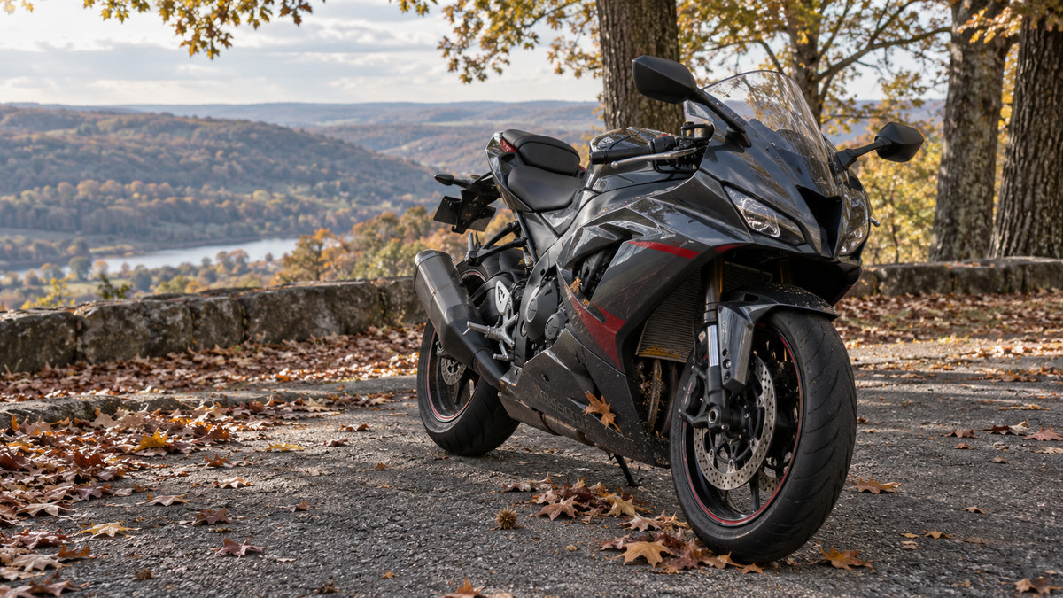 AI editorial concept of a full-fairing sportbike parked at an autumn overlook with leaves around the lower fairing and radiator openings