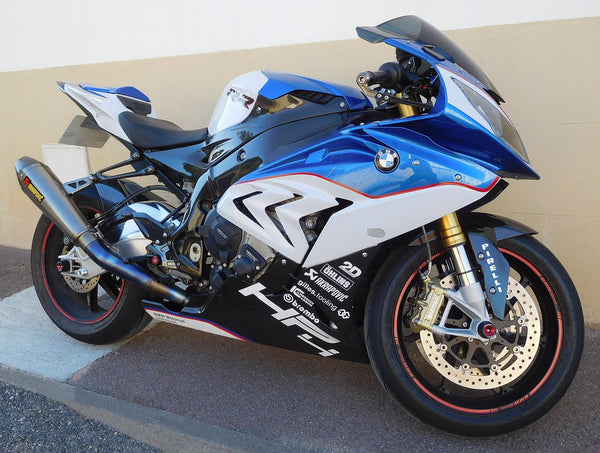 Blue and white BMW HP4-marked bodywork with a thin red separator, photographed outdoors