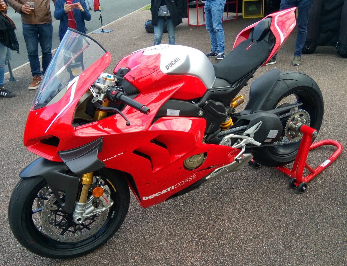 Real 2019 Ducati Panigale V4 R photographed at Magny-Cours from the front-left side, showing wing and lower fairing; not a NiceFairings product or fitment reference