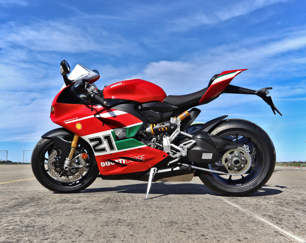 2023 Ducati Panigale V2 Bayliss motorcycle photographed from the side; exterior lower fairing visible, internal heat protection not shown