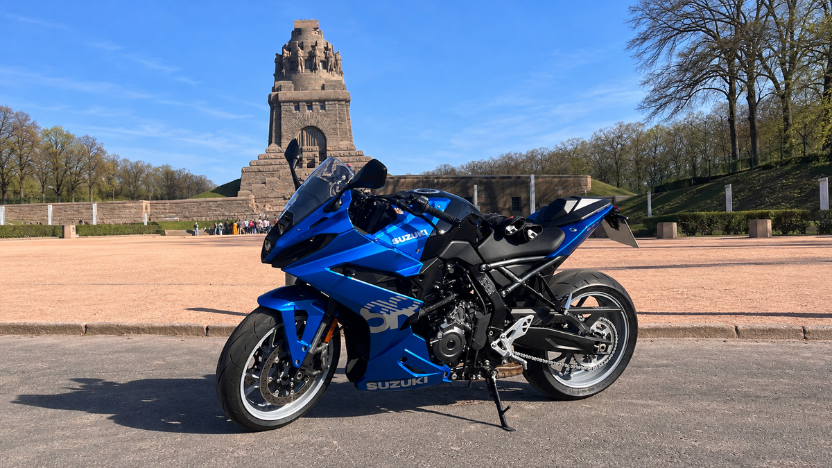 Real blue Suzuki GSX-8R photographed by PauleMeister outdoors, with AI-expanded background to keep the complete motorcycle visible; visual reference, not a NiceFairings product