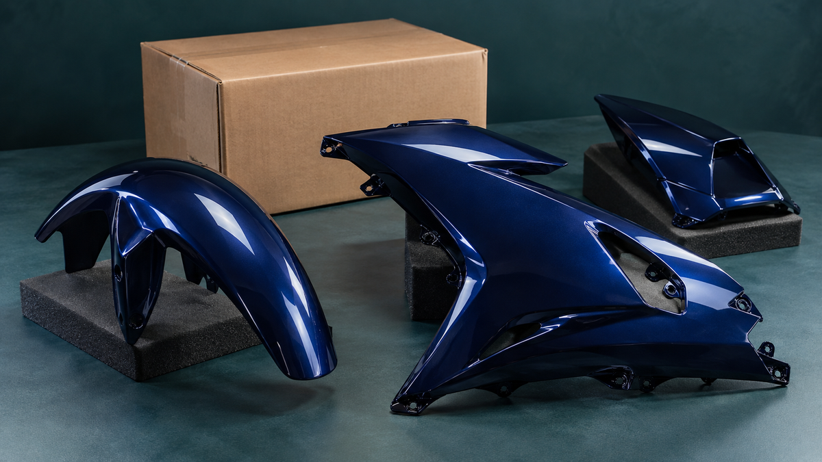 AI illustration of dark blue fairing pieces and a closed shipping box