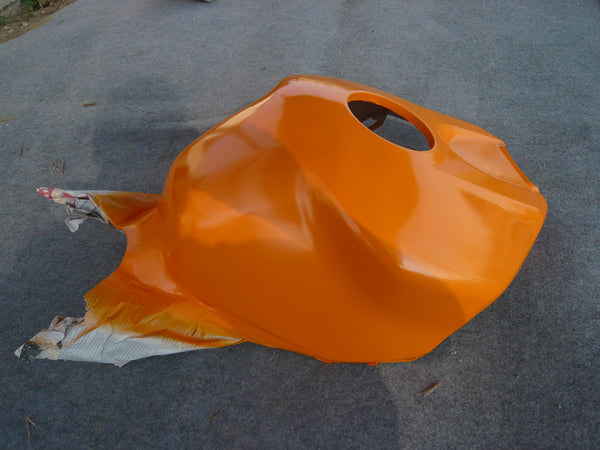 NiceFairings production photograph of an orange painted tank-cover panel with masking paper