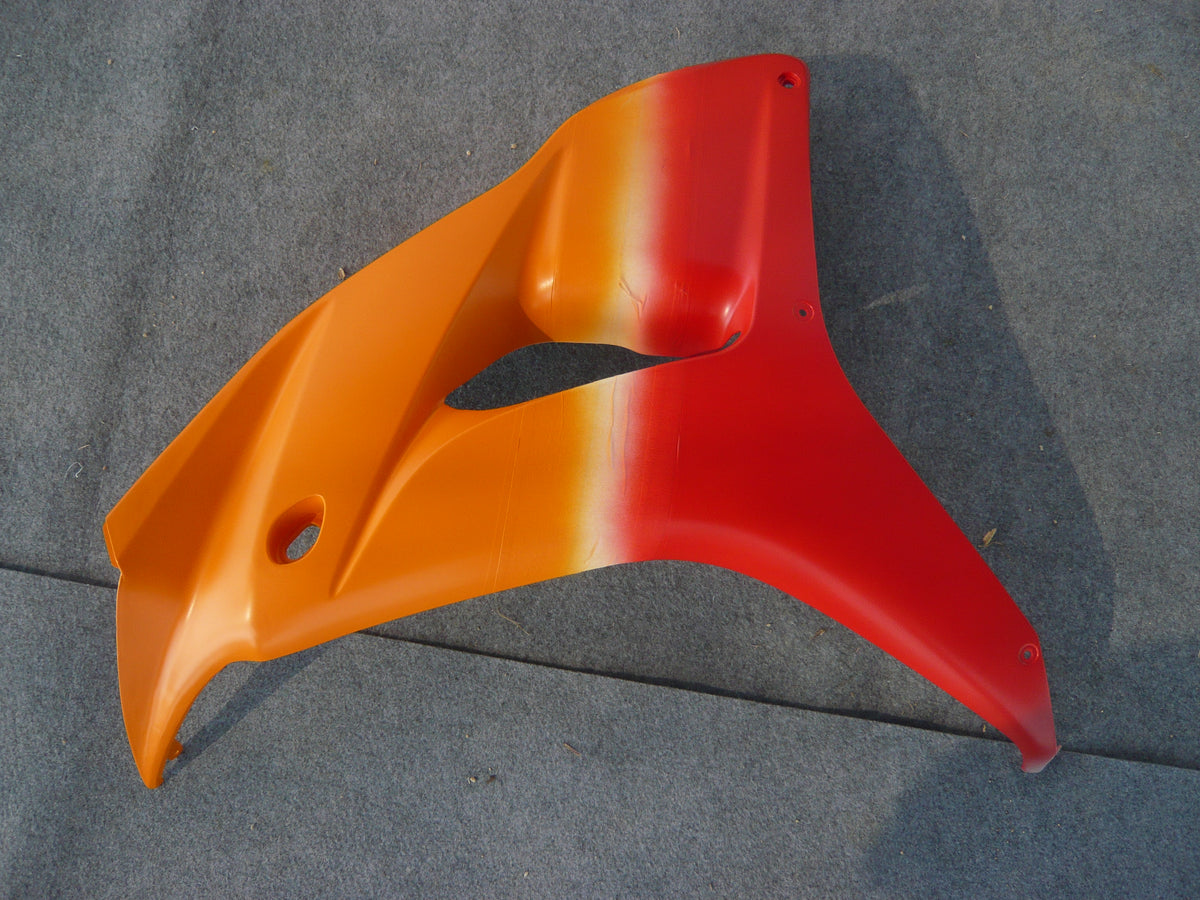 NiceFairings production photograph of an orange-to-red painted side panel