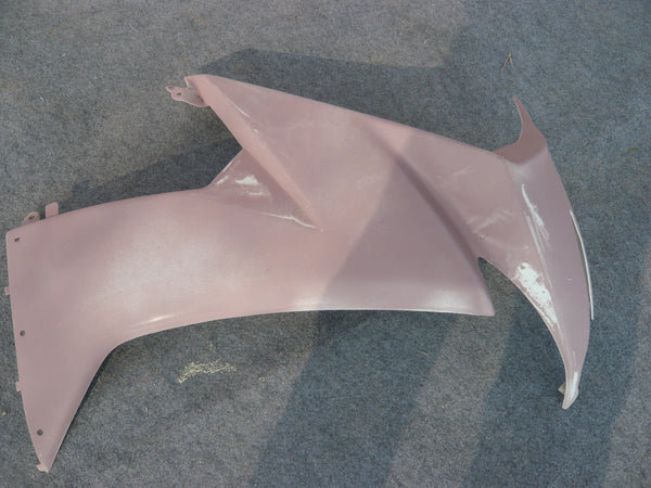 Real motorcycle fairing side panel during surface preparation in the NiceFairings workshop; this photo does not establish the plastic grade or forming process