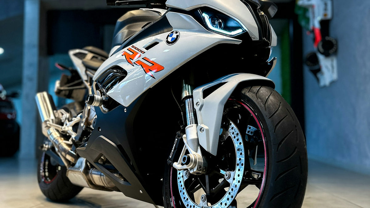 White BMW S 1000 RR sport motorcycle showing its full fairing and aerodynamic bodywork