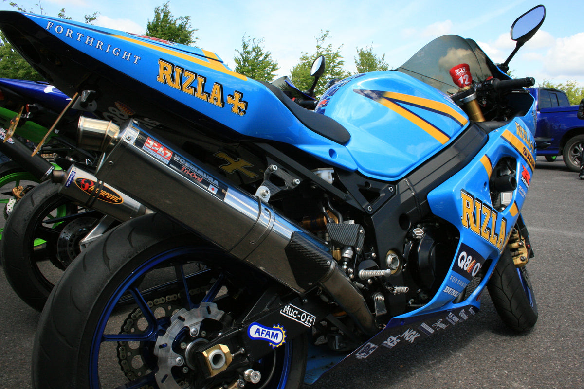 Rizla-themed Suzuki GSX-R1000 outdoors viewed from the rear right