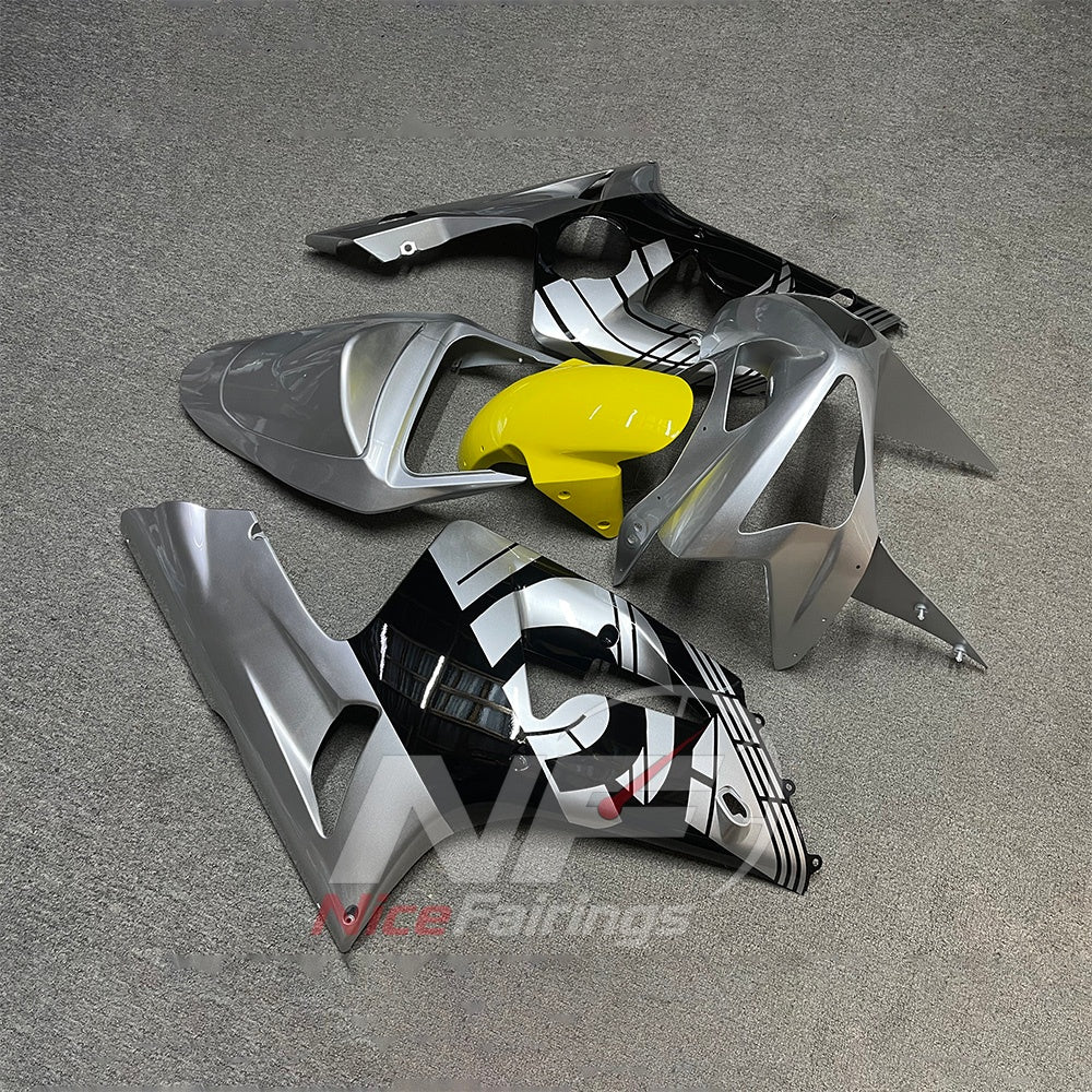 Kawasaki ZX6R 2003-2004 Silver-gray graphic panels with yellow center - angled view